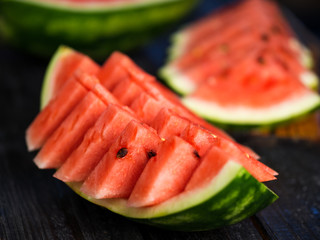 Sliced delicious ripe watermelon on the table close-up