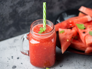 Glass jar of delicious summer watermelon smoothie