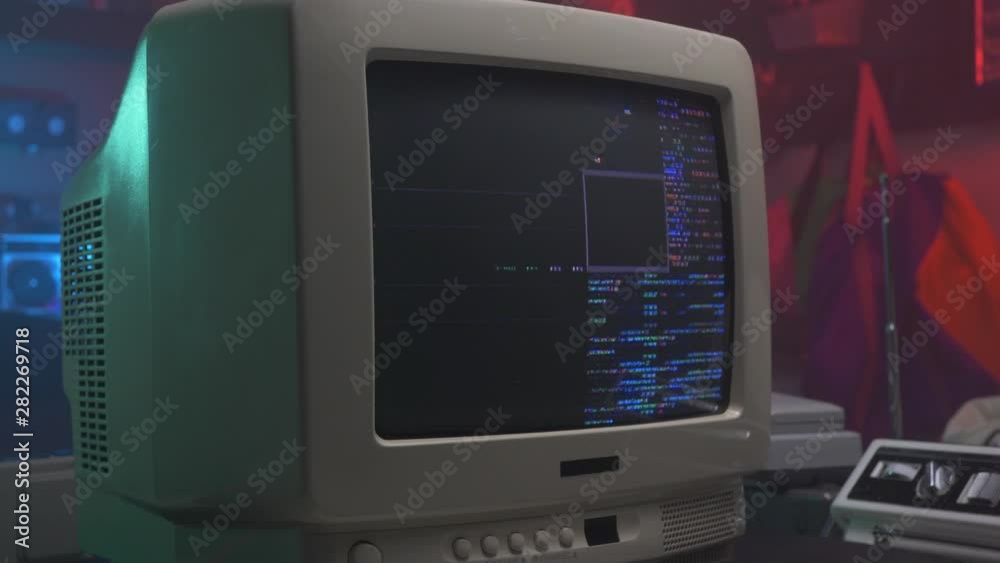 Wall mural hacking screen with coding on a retro old computer monitor or tv from the 90s 80s