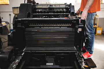 An old printing machine in printing factory