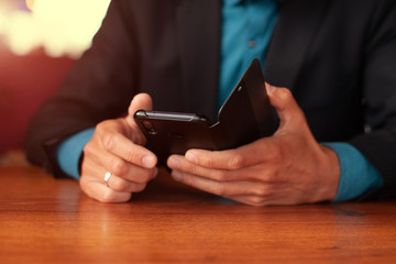 man with phone in cafe