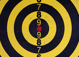 Black and yellow target with red bulls eye