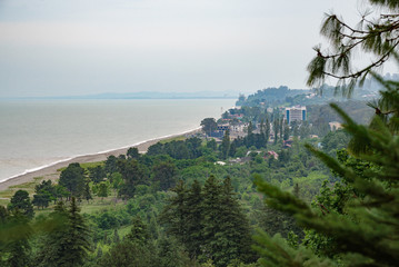view of the tourist city of Batui from the height of the observation deck of the botanical garden, in cloudy weather with clouds in the sky.