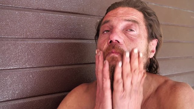 Down-and-out person on the street. Real person with no fixed abode, homeless man