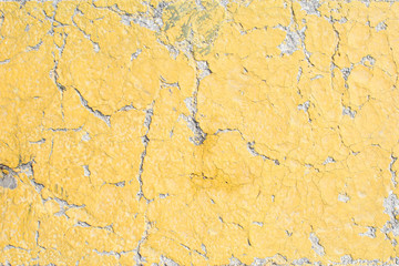 Yellow cracked paint.