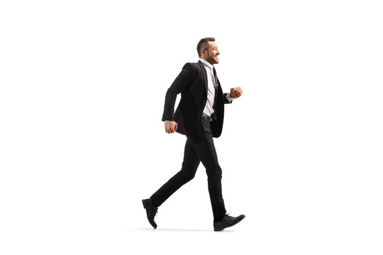 Businessman In A Black Suit Running And Smiling