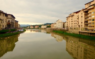 Fototapeta na wymiar The Arno River in Florence Italy seen from the Ponte Vecchio