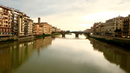 Fototapeta na wymiar The Arno River in Florence Italy seen from the Ponte Vecchio