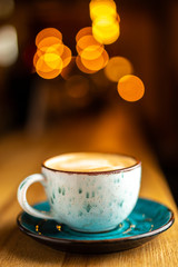 Hot aroma cappuccino latte coffee on the bar, blurred background