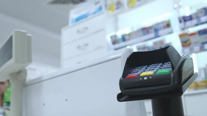 Supermarket: Checkout Counter Customer Pays with Smartphone for His Food Items.