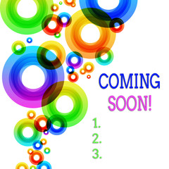 Word writing text Coming Soon. Business photo showcasing event or action that will happen after really short time Vibrant Multicolored Circles Disks of Different Sizes Overlapping Isolated