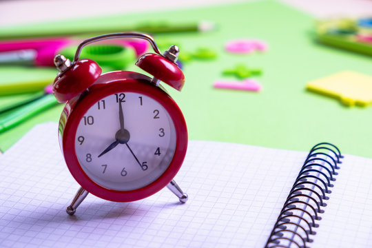 Red alarm clock on light Blank note. Reminder. Space for copy. Minimal concept.