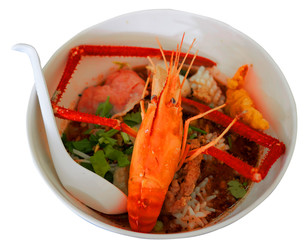 Noodles with spicy pawn soup or Tom yum kung in bowl on isolated white background