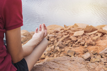 Closeup woman practice yoga in nature background.
