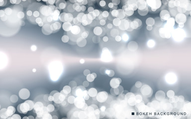 Silver abstract bokeh background sparkling lights effect. Blured circle on gray background.