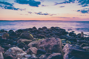 Rocks in the ocean at sunset rhode island