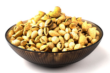 nuts almonds in the shell, lay in a bowl, on a white background