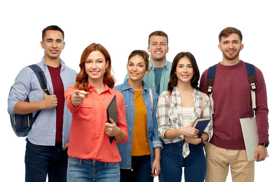education, high school and people concept - group of smiling students with books and bags pointing at you over white background