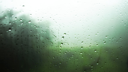 Watching rain from glass window