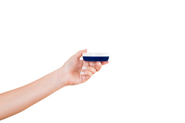 Female hand holding cream bottle of lotion isolated. Girl give jar cosmetic products on white background