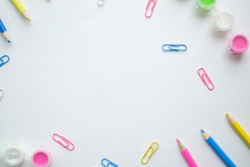 Pencil and metal clips on white background 