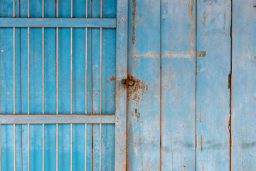Old blue door with padlock (texture / background)