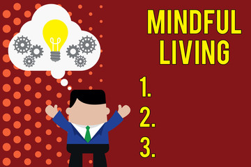 Writing note showing Mindful Living. Business concept for Fully aware and engaged on something Conscious and Sensible Man hands up imaginary bubble light bulb working together