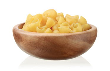 Pasta in a wooden bowl isolated on white