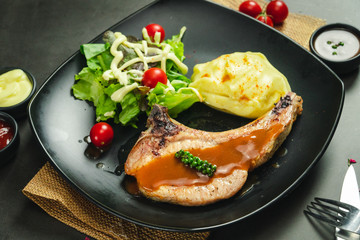 Food shot of pork chop steak with mashed potato