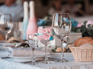 Two glasses of champagne on the background of the wedding bouquet of roses.