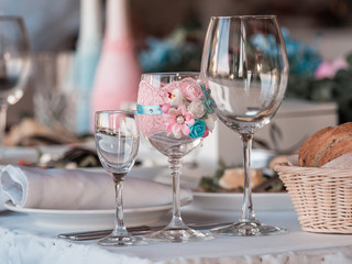 Two glasses of champagne on the background of the wedding bouquet of roses.