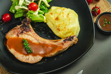 Food shot of pork chop steak with mashed potato