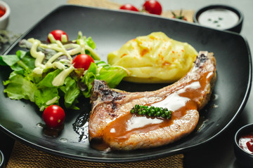 Food shot of pork chop steak with mashed potato