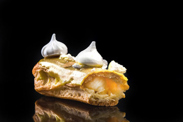 French Artisan Eclair on Black Reflective Background,Copy Space