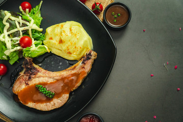Food shot of pork chop steak with mashed potato
