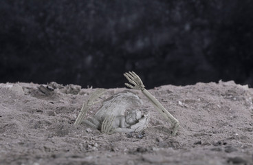  Religious background - hell realm.Halloween.Angel figurine in hellish ashes