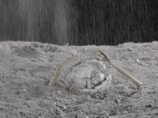  Religious background - hell realm.Halloween.Angel figurine in hellish ashes