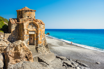 Agios Pavlos beach with Saint Paul church, a very old Byzantine church that was built at the place Selouda, an incredible beach at Opiso Egiali area, Chania, Crete, Greece.