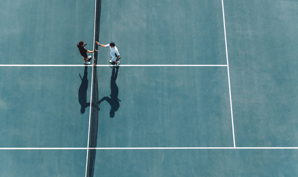 Professional tennis players handshakes after the match - Powered by Adobe