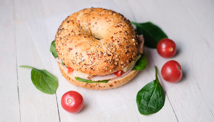 Delicious classic blt sandwiches with ham, cheese, bacon, tomatoes. Breakfast and fast food meal. on isolated black background wooden and text copy space.