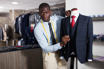 Designer is creating business image with red tie