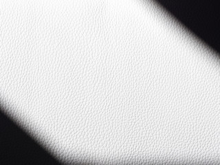 White leather fabric is cut with two deep black diagonal shadows top left and bottom right.Black and white contrasting abstract background - Image