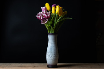 one vase with a bouquet of tulips