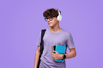 Modern teen student listening to music