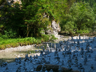 Griessbach Gorge in Erpfendorf, Tyrol alps, Austria - wild stream running over stones, wild water