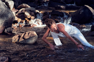 Mature Yoga Woman dancing her wild mountain river Prana Shakti ( female energy ).   