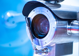 Video camera in a metal case with a cleaner. Video surveillance in production. Moistureproof camera. Shock resistant camera. Video camera for installation in places with harsh environmental conditions © Grispb