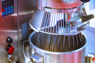 Blender in an industrial meat grinder. Equipment for processing meat at production. Meat grinder for restaurants and cafes. Food industry.