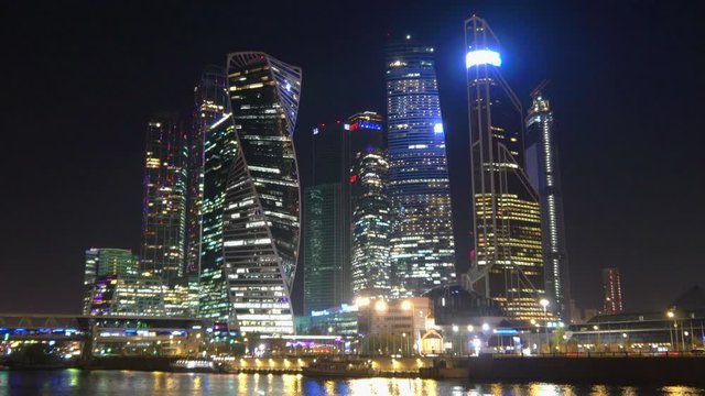 Panorama of the night city. Glowing Skyscrapers business center in Moscow. Time laps