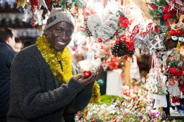 Man selecting festive Christmas decoration